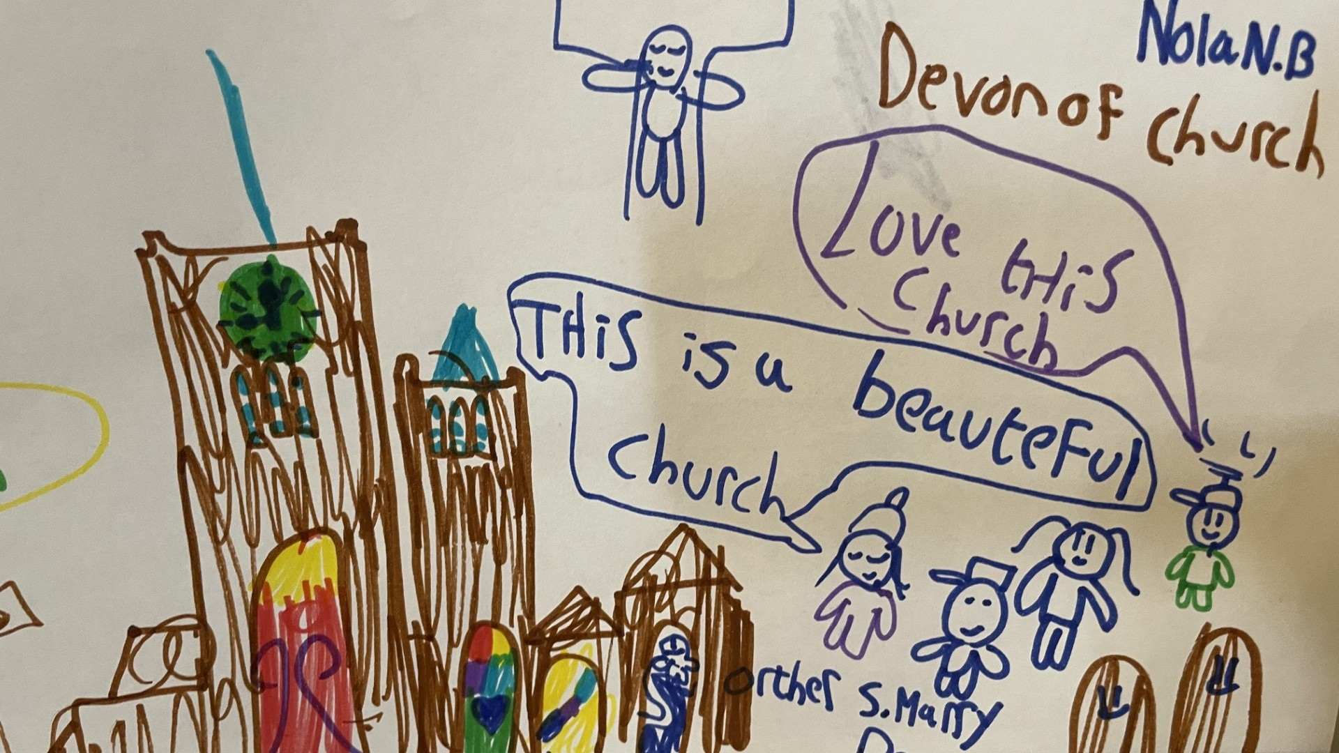 A drawing of the church left by a child who visited over the summer holidays. Speech bubbles from the family who are pictured read: "I love this church" and "This is a beautiful church"